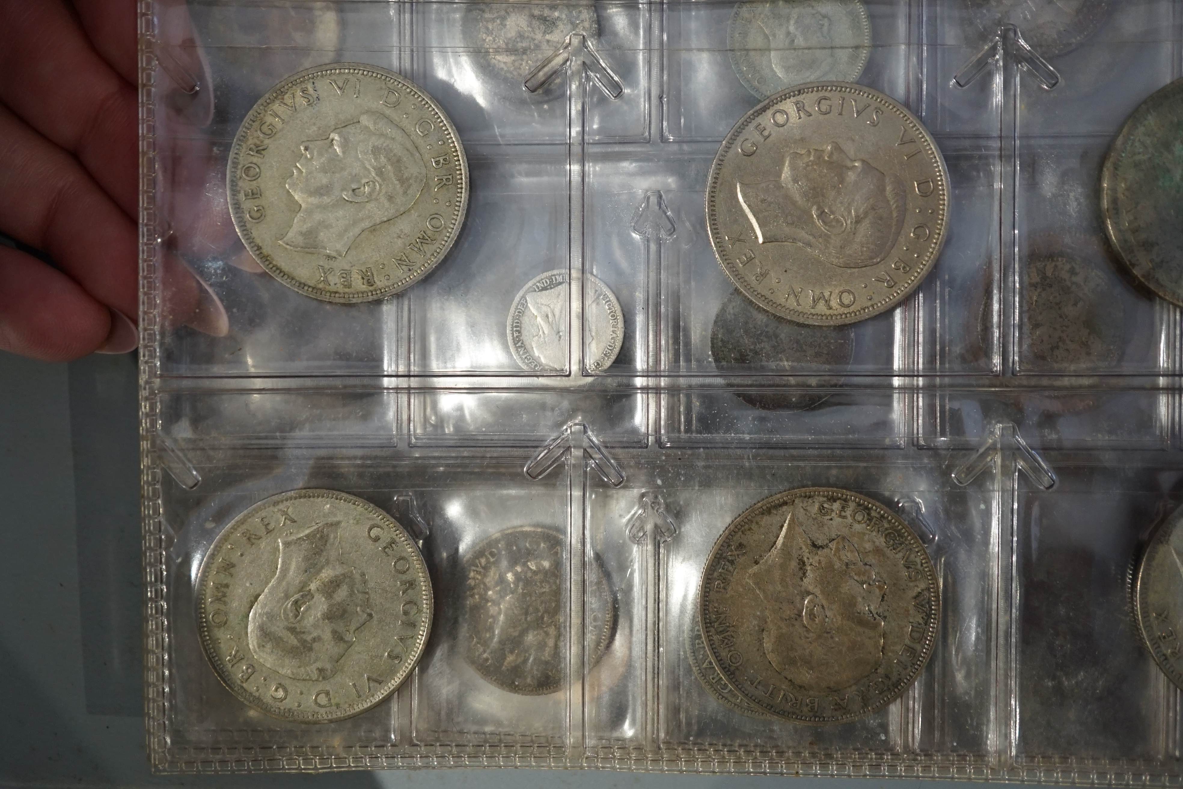 British and World coins, in an album and loose, together with banknotes, highlights include George V halfcrown 1923, about EF, and various pre-1947 silver coins